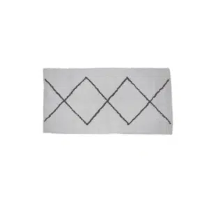 Tapis berbère en coton blanc avec des traits noir en diagonale formant des losanges